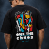 Man wearing the black Half Skull Abstract Soul oversized T-shirt with the cubist face and Own The Chaos back print