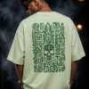 Back of the mint green Aztec Skull oversized T-shirt showing the green Mesoamerican glyph panel around a sugar skull