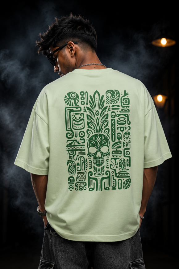 Back of the mint green Aztec Skull oversized T-shirt showing the green Mesoamerican glyph panel around a sugar skull