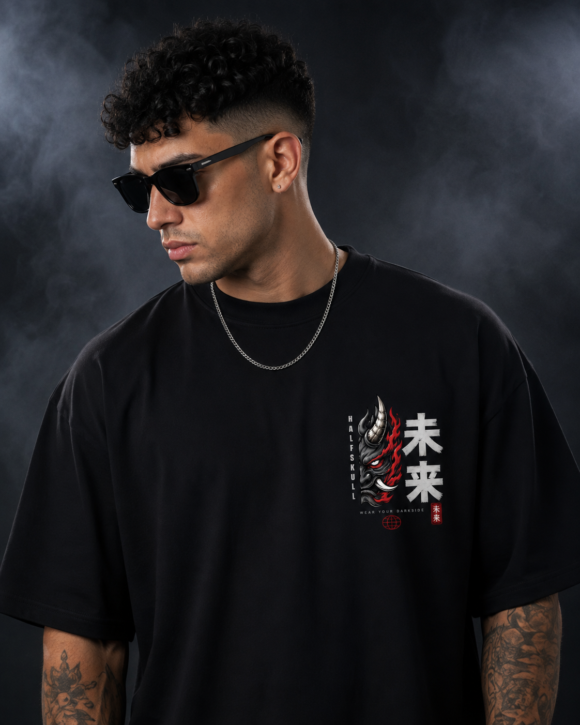 Close view of the left chest print on the black Inferno Oni oversized T-shirt, half oni mask beside brushed kanji